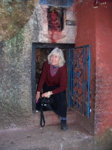 Award-winning poet, essayist and book artist, Marilyn Stablein, exiting a popular cave shrine in Kathmandu